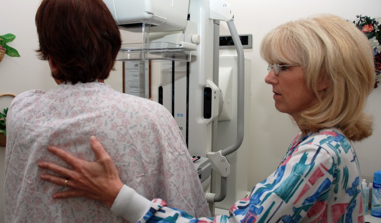 080922-N-2688M-004 
SAN DIEGO (Sept. 22, 2008) Lead Mammography Technologist Carmen Waters, Naval Medical Center San Diego (NMCSD) Breast Health Center, assists a patient preparing for a mammography. In conjunction with NMCSDs pharmacy, the Breast Health Center has started a new program called ÒMammograms While You WaitÓ which allows patients to take the exam while their prescriptions are being filled. (U.S. Navy photo by Mass Communication Specialist 2nd Class Joseph Moon/Released)